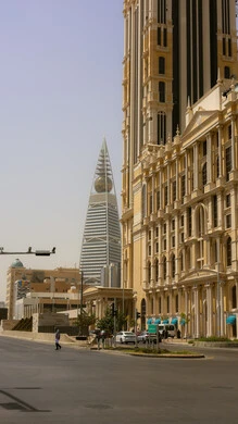 The development and urban progress of facilities in the Kingdom of Saudi Arabia, modern and advanced architectural designs, a view of the clear blue sky, a famous tourist site, the engineering art of towers and skyscrapers, Al Faisaliah Tower in the capital, Riyadh, during the day