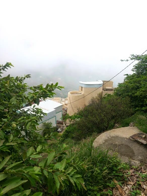 A natural tourist place and area, trees, plants and green spaces, agricultural terraces on the mountain slopes, old popular houses on the Fifa Mountains in Jazan, southern Saudi Arabia, rocky peaks and heights during the day