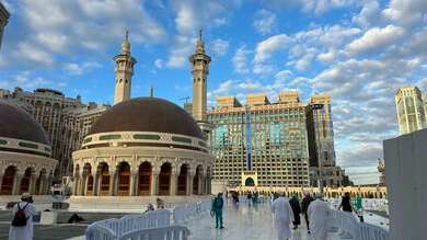 Visitors to the House of God in the streets surrounding the Grand Mosque in Mecca, sacred Islamic religious sites and landmarks in the Kingdom of Saudi Arabia, performing Hajj and Umrah rituals, pilgrims and Umrah performers strolling in the streets
