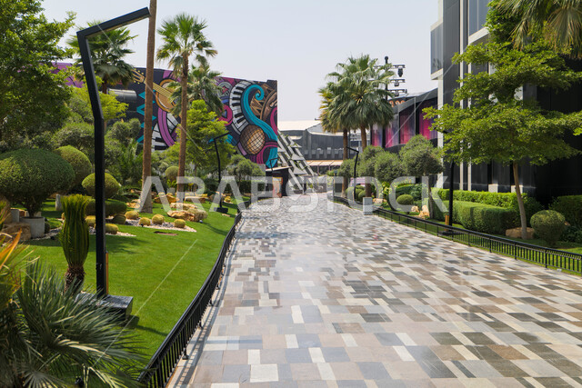 An outdoor urban park in King Abdullah Financial District (KAFD) in Riyadh, achieving economic renaissance, leading banking companies, the ideal destination for finance and business in Saudi Arabia, modern architectural art for commercial buildings