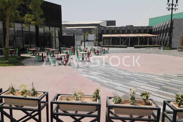 The outdoor plazas in front of King Abdullah Financial District (KAFD) in Riyadh during the day, achieving economic renaissance, leading companies in banking services, the ideal destination for finance and business in the Kingdom of Saudi Arabia, modern architectural art for commercial buildings