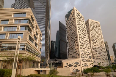 The ideal destination for finance and business in the Kingdom of Saudi Arabia, modern architectural style of commercial buildings, King Abdullah Financial District (KAFD) towers in Riyadh during the day, achieving economic renaissance, leading companies in banking services