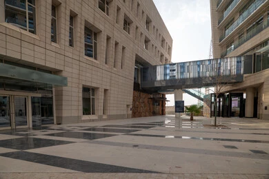 The ideal destination for finance and business in the Kingdom of Saudi Arabia, modern architectural style of commercial buildings, King Abdullah Financial District (KAFD) towers in Riyadh during the day, achieving economic renaissance, leading companies in banking services