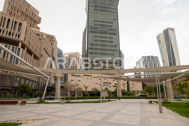 The outdoor plazas in front of King Abdullah Financial District (KAFD) in Riyadh during the day, achieving economic renaissance, leading companies in banking services, the ideal destination for finance and business in the Kingdom of Saudi Arabia, modern architectural art for commercial buildings