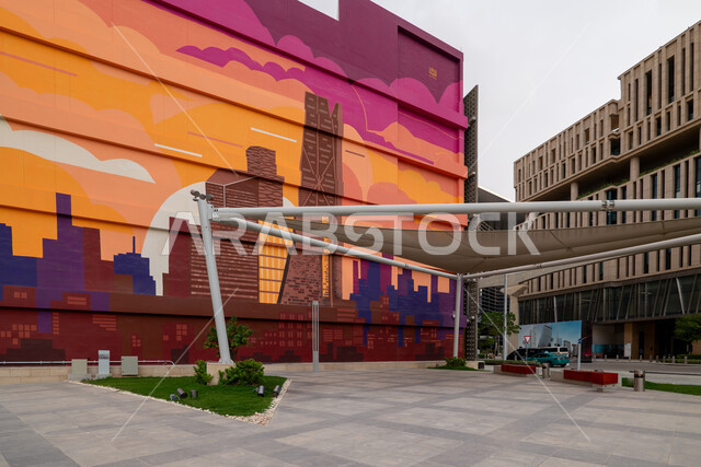 رسومات جدارية للمعالم في مركز الملك عبدالله المالي (كافد) في مدينة الرياض في النهار, تحقيق النهضة الاقتصادية, الشركات الرائدة في الخدمات المصرفية، الوجهة المثالية للمال والأعمال في المملكة العربية السعودية، الفن الهندسي المعماري على الطراز الحديث للمباني التجارية