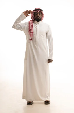 Greeting and peace, the concept of reception and welcome, a portrait of a Saudi Arabian man wearing traditional attire and a ghutrah raising his hand with gestures of friendliness, acquaintance and friendship and building relationships, full body length, white background.