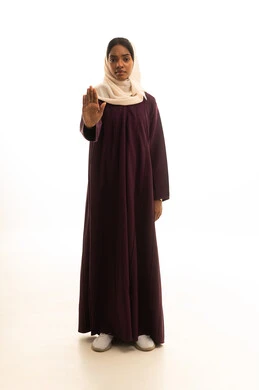 Expressions of rejection and refusal, an order to stop doing something, a portrait of a Gulf Arab Saudi woman wearing an abaya and hijab raising her hand with gestures indicating prohibition, an elegant young Saudi woman, feeling of annoyance and anger, full-body image, white background.