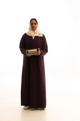 Preparation for the new academic year, higher education in the universities of the Kingdom, modern curricula and educational materials, a portrait of a dark-skinned Arab Gulf Saudi university student wearing an abaya and hijab, carrying a backpack with a collection of books, white background.