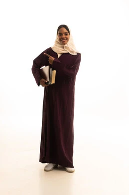Setting a specific goal, higher education in the universities of the Kingdom, modern curricula and educational materials, preparation for the new academic year, a portrait of a Gulf Arab Saudi university student with a dark complexion wearing an abaya and hijab, carrying a backpack with a collection of books, white background.