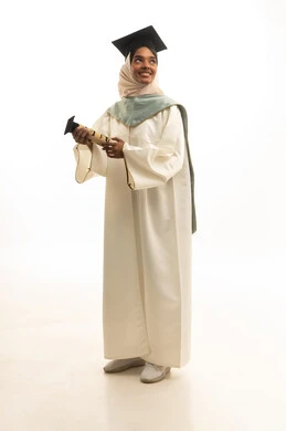 The concept of excellence and success, taking personal photos in graduation attire, celebrating the completion of university studies, a portrait of a Gulf Arab Saudi female student wearing a graduation cap and gown looking with expressions of joy, white background. The concept of excellence and success, taking personal photos in graduation attire, celebrating the completion of university studies, a portrait of a Gulf Arab Saudi female student wearing a graduation cap and gown looking with expressions of joy, white background.
