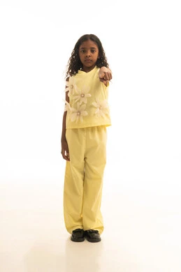 Clarification and pointing to something, a portrait of a Gulf Arab Saudi girl wearing casual attire and pointing with her index finger to a specific location, indicating a certain place, gestures and hand movements indicating this place (here), full-body image, white background.