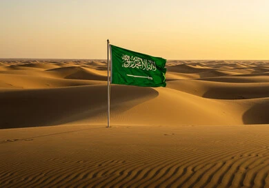 Planting the flag of the Kingdom of Saudi Arabia in the middle of the desert, the banner of unification and the emblem of the nation, celebrating national occasions and holidays, Flag Day March 11, Saudi National Day September 23