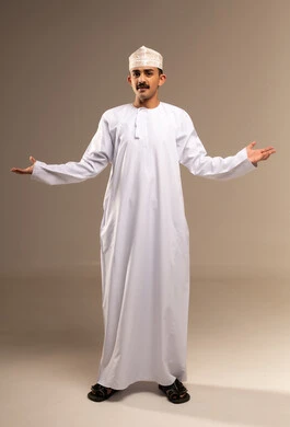 Opening the hands wide with an expression of not knowing the required matter, not offering help due to lack of knowledge about the thing, gestures of forgetting a certain matter, the concept of elegance and masculinity, a portrait of an Arab Gulf Omani man wearing a dishdasha and kumma standing, attention to external appearance, full-length body, beige background. Opening the hands wide with an expression of not knowing the required matter, not offering help due to lack of knowledge about the thing, gestures of forgetting a certain matter, the concept of elegance and masculinity, a portrait of an Arab Gulf Omani man wearing a dishdasha and kumma standing, attention to external appearance, full-length body, beige background.