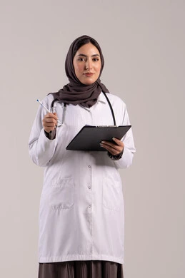 Recording important data and notes, working in centers and hospitals, medicine and healthcare, a portrait of an Arab Gulf Emirati female doctor wearing a white medical coat, wearing a stethoscope, holding a clipboard in her hand, a young Saudi woman providing medical assistance, brown background.