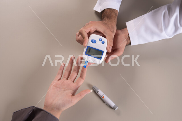 Measuring blood sugar at home, a close-up portrait of a nurse's hand wearing a uniform checking the blood sugar level of an Emirati Gulf Arab patient wearing an abaya, home healthcare, quick monitoring of sugar levels, brown background.
