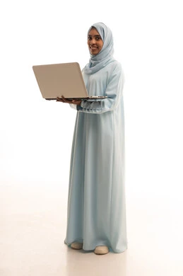 The use of modern and advanced devices, remote business management, a portrait of a Saudi Gulf Arab woman wearing an abaya and hijab using a laptop, integrating technology into work, completing tasks required via the laptop, full-body, white background. The use of modern and advanced devices, remote business management, a portrait of a Saudi Gulf Arab woman wearing an abaya and hijab using a laptop, integrating technology into work, completing tasks required via the laptop, full-body, white background.