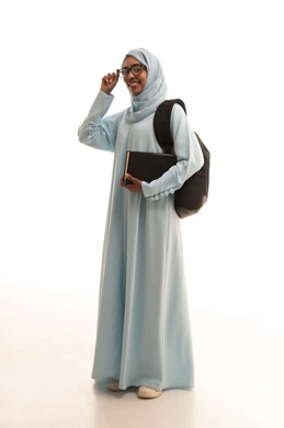 Modern curricula and educational materials, higher education in the universities of the Kingdom, preparation for the new academic year, a portrait of a university student, an Arab Gulf Saudi woman wearing a hijab, wearing glasses, carrying a backpack with a book, showing gestures of joy, full-body image, white background.