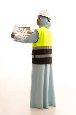 Management of engineering projects and construction, the concept of studying the plan and construction project, a profession and engineering job for women, a portrait from behind of an Arab Gulf Saudi engineer wearing an abaya, jacket, and safety helmet working in the engineering sector in the Kingdom of Saudi Arabia, white background. Management of engineering projects and construction, the concept of studying the plan and construction project, a profession and engineering job for women, a portrait from behind of an Arab Gulf Saudi engineer wearing an abaya, jacket, and safety helmet working in the engineering sector in the Kingdom of Saudi Arabia, white background.