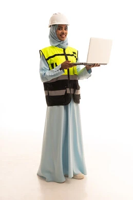 Completing work tasks via a laptop, managing engineering projects, a portrait of a Saudi Gulf Arab engineer wearing a jacket and safety helmet holding a laptop, working in the engineering sector, studying project fundamentals, full-body image, white background.