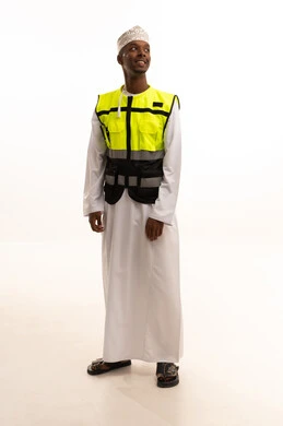 Working in the engineering sector, the concept of engineering and architectural constructions, a portrait of a young Arab Gulf Omani man with a dark complexion wearing a dishdasha, a kumma, a helmet, and a safety vest, looking with gestures of joy, Omani professions and jobs, construction with the hands of the nation's sons, white background. Working in the engineering sector, the concept of engineering and architectural constructions, a portrait of a young Arab Gulf Omani man with a dark complexion wearing a dishdasha, a kumma, a helmet, and a safety vest, looking with gestures of joy, Omani professions and jobs, construction with the hands of the nation's sons, white background.