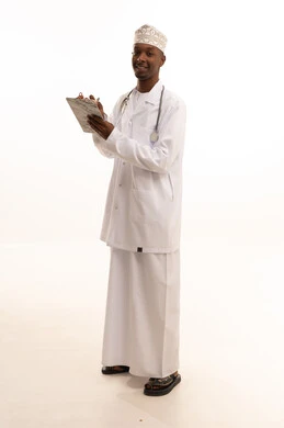 Taking medical notes, providing services to patients efficiently, writing medical consultations, a portrait of a young Arab Gulf Omani man with a dark complexion wearing a dishdasha and kumma with a white coat holding a notebook in his hand, health professions and jobs, white background.