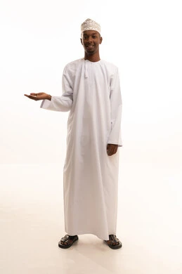 Gestures of joy and happiness, using the sense of touch to lift holographic elements, a portrait of a young Arab Gulf Omani man with a dark complexion wearing a dishdasha and kumma, raising his hand with gestures of carrying and lifting something, white background.