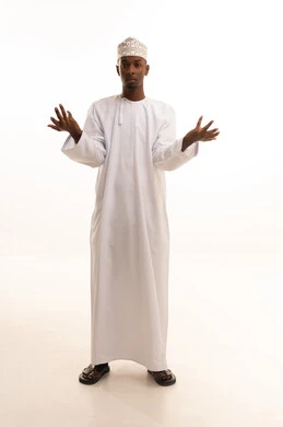 Mystery and ambiguity, questioning and astonishment, inquiring about a certain matter, asking about a specific topic, a portrait of a young Arab Gulf Omani man with a dark complexion wearing a dishdasha and a kumma, raising his hands upwards with gestures of ignorance, full-body image, white background.