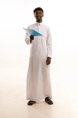 Preparing work-related reports, proofreading notes, a portrait of a young Arab Gulf Saudi man with a dark complexion wearing a white thobe holding a stack of white papers, reviewing and following up on office plans and projects with focused gestures, white background.