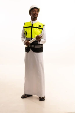 Professionalism in planning, monitoring, and directly supervising work, construction by the hands of the nation's sons, the concept of engineering and architectural constructions, a portrait of a dark-skinned Saudi Gulf Arab engineer wearing traditional attire and a special jacket and safety helmet, standing with an engineering plan in hand, full-body, white background. Professionalism in planning, monitoring, and directly supervising work, construction by the hands of the nation's sons, the concept of engineering and architectural constructions, a portrait of a dark-skinned Saudi Gulf Arab engineer wearing traditional attire and a special jacket and safety helmet, standing with an engineering plan in hand, full-body, white background.