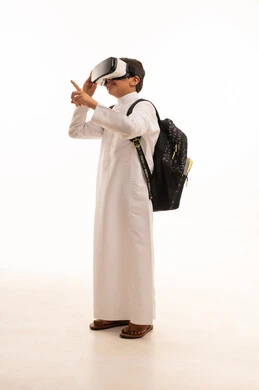 Virtual reality activities, cross-platform learning, virtual world simulation, portrait of a Saudi Arabian Gulf student wearing traditional thobe and school backpack, wearing VR glasses, full body image, white background
