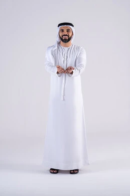 The concept of praise, gratitude, and asking for help. A portrait of an Arab Gulf Emirati man wearing a kandura and ghutra, raising his hands with gestures of supplication and prayer to God, worshipping God and desiring the fulfillment of wishes, and expressions of asking for forgiveness.