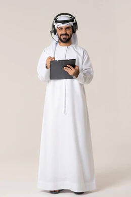 Organizing and managing business, writing daily tasks and goals, noting and recording observations and information on paper, a portrait of a smiling young Emirati Arab man wearing a kandura and a white ghutrah with headphones, holding a folder and a pen in his hand, full body, white background.