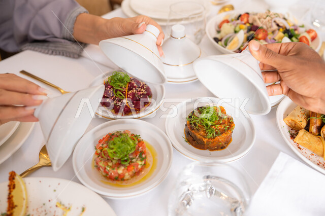 Sharing delicious meals, a table of the most delicious Western foods in a high-end restaurant, delicious healthy dishes, restaurants serving Arabic and Western cuisine in the United Arab Emirates, foods with high nutritional value