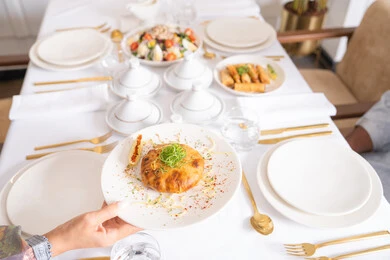 A table of the most delicious Western foods in an upscale restaurant, delicious healthy dishes, restaurants serving Arabic and Western cuisine in the United Arab Emirates, delicious meals, foods with high nutritional value