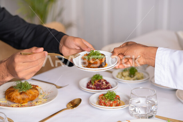 Sharing delicious meals, a table of the most delicious Western foods in a high-end restaurant, delicious healthy dishes, restaurants serving Arabic and Western cuisine in the United Arab Emirates, foods with high nutritional value