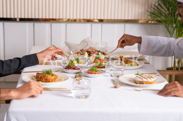 A table of the most delicious Western foods in an upscale restaurant, delicious healthy dishes, restaurants serving Arabic and Western cuisine in the United Arab Emirates, delicious meals, foods with high nutritional value
