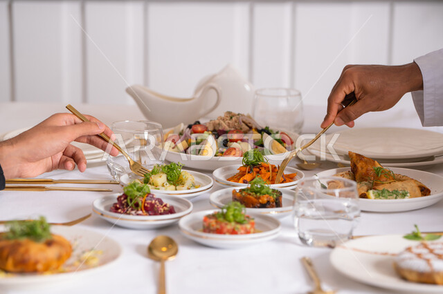 A table of the most delicious Western foods in an upscale restaurant, delicious healthy dishes, restaurants serving Arabic and Western cuisine in the United Arab Emirates, delicious meals, foods with high nutritional value