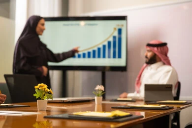 A Saudi office profession and job, developing work and solving problems, using modern technical devices, unity and teamwork, studying and analyzing new projects, exchanging experiences and ideas, workshops and training, conducting a meeting for a team of Saudi Gulf Arab workers within the company's headquarters.
