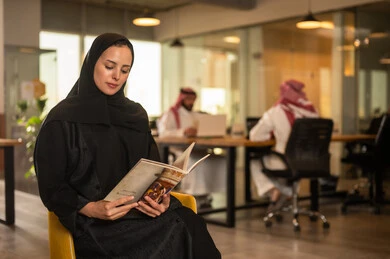 Enjoying reading magazines and books during a work break in a Saudi company, acceptance and approval between companies, studying and analyzing new projects, exchanging experiences and ideas, workshops and training, holding a meeting for a team of Arab Gulf Saudis within the company premises.