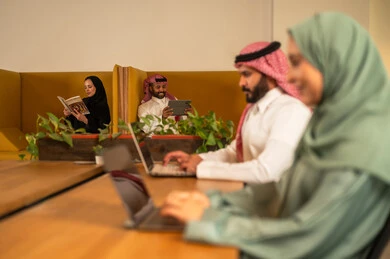 The concept of teamwork, project and investment development, studying statistical data papers, managing and dividing tasks, a Saudi Gulf Arab team conducting a business meeting in the company's conference room, integrating modern technological devices into office work. The concept of teamwork, project and investment development, studying statistical data papers, managing and dividing tasks, a Saudi Gulf Arab team conducting a business meeting in the company's conference room, integrating modern technological devices into office work.