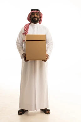 Reliable shipping and delivery process, fast delivery services, ordering and receiving delivery, portrait of an Arab Saudi Gulf man wearing traditional attire and a ghutrah working in delivering orders and goods to customers, online shopping and online orders, white background.