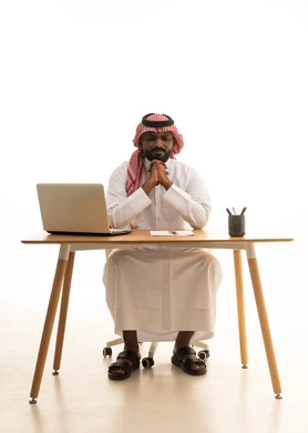 Expressions of sadness and frustration, remote work, the concept of electronic marketing, Saudi professions and jobs, holding a business meeting via laptop, a portrait of a Saudi Gulf Arab man wearing traditional attire and a ghutrah using a laptop, browsing social media, using modern technological devices, white background. Expressions of sadness and frustration, remote work, the concept of electronic marketing, Saudi professions and jobs, holding a business meeting via laptop, a portrait of a Saudi Gulf Arab man wearing traditional attire and a ghutrah using a laptop, browsing social media, using modern technological devices, white background.