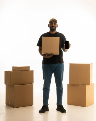 A portrait of a Saudi Arabian Gulf man wearing casual attire delivering boxes of household items while holding a mobile phone, owning a new home and family stability, modern housing and ownership, using technology and modern techniques, organizing and arranging the home, full-body image, white background.