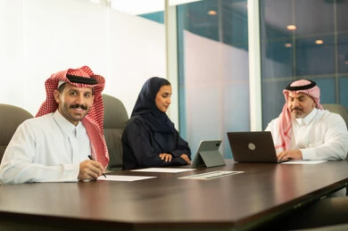 Discussing work plans, providing a comfortable work environment, the concept of team spirit and collective achievement, developing strategies and businesses, success and achieving goals, using modern devices and technologies to accomplish office tasks, Saudi and Gulf Arab employees in a meeting at the company headquarters.