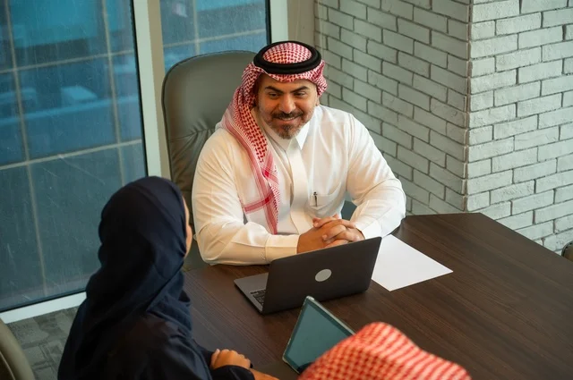 Workshops and training, exchanging experiences and ideas, studying and analyzing new projects, using modern technical devices, unity and teamwork, developing work and solving problems, holding a meeting for a team of Saudi Gulf Arab workers inside the company headquarters, a Saudi office profession and job.