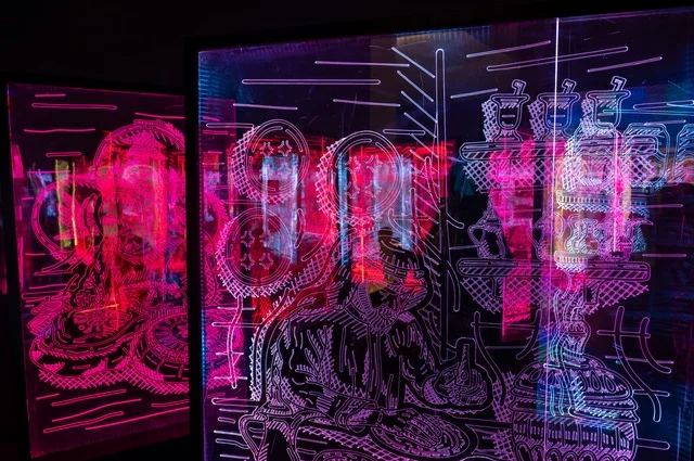 A digital art design featuring intricate patterns and vibrant colors, an illustration characterized by intersecting lines, geometric shapes, and complex decorative patterns, the bright colors give the impression of being illuminated or representing light effects.