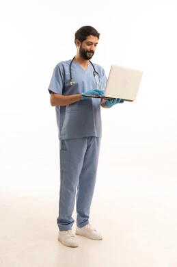 Integrating technology into the medical field, the concept of medicine and healthcare, a portrait of a Saudi Arabian Gulf Arab nurse wearing a uniform with a stethoscope providing services to patients and holding a laptop, a medical profession and job, working in the health sector in the Kingdom, full body, white background