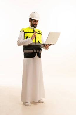 Using a modern and advanced technical device, Saudi national construction projects, the concept of architecture, interest in urban development by Saudi engineers, portrait of a Saudi Arabian Gulf engineer wearing a work jacket and a protective helmet, holding a laptop, full body, white background