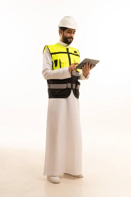 The concept of architecture, interest in urban development by Saudi engineers, use of modern and advanced technical equipment, Saudi national construction projects, portrait of a Saudi Arabian Gulf engineer wearing a work jacket and a protective helmet, holding a tablet, full body length, white background