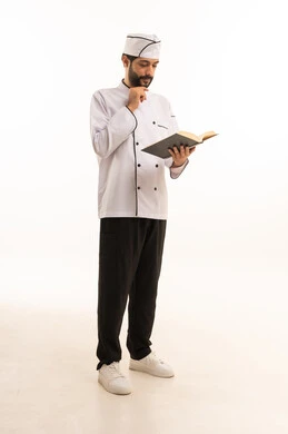 Cooking recipe review, portrait of a Saudi Arabian Gulf Arab cook wearing a cooking uniform holding a cookbook with a happy expression, full body, white background